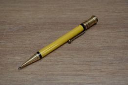 An early Parker Duofold Senior propelling pencil in mandarin yellow