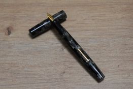 A Le Merle Blanc leverfill fountain pen in black grey marble made by the Swan people having a Swan 2