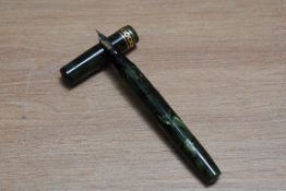 A Mabie Todd & Co Swan Visofil fountain pen in emerald with peirced band and two narrow bands to the