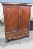 A 19th Century mahogany linen press style cupboard having open interior with hanging rail, width 133
