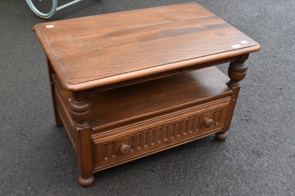 A 20th Century Ercol TV stand, with lift corner flap to rear, width approx. 73cm