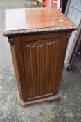 An early 20th Century mahogany pot cupboard having linen fold panels and door