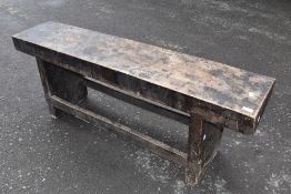 A rustic elm bench , with historical worm, width approx. 134cm
