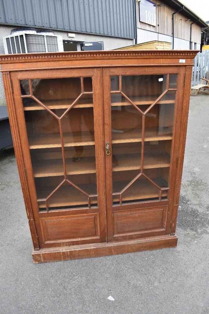 A 19th Century oak bookcase with astral glazed doors, dimensions approx. W113 D37 H144cm