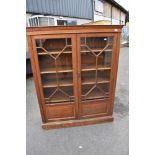 A 19th Century oak bookcase with astral glazed doors, dimensions approx. W113 D37 H144cm