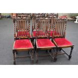 A set of six early 20th Century oak dining chairs having rail back , barley twist frames and drop in