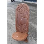 A traditional African Palaver chair havimg carved decoration, possibly Springbok