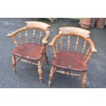 A pair of late 19th or early 20th Century smokers bow armchairs