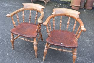 A pair of late 19th or early 20th Century smokers bow armchairs