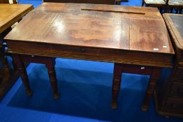 A 19th Century mahogany large clerks desk on married stained frame having turned legs, width approx.