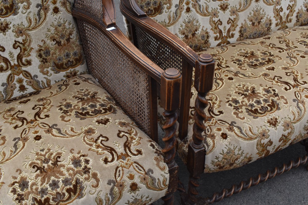 A late 19th or early 20th Century three piece lounge suite having oak twist frae, bergere cane sides - Image 2 of 2