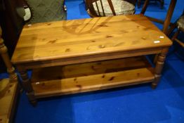 A pine coffee table having undershelf, dimensions approx. 106 x 53 x 46cm