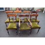 A set of seven (six plus one) 19th Century Regency design dining chairs having rail backs