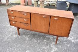 A 1970s teak sideboard, labelled Beautility, width approx 153cm, depth 45cm