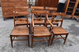 A set of six (five plus 1) 19th Century mahogany railback kitchen chairs having solid seats