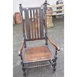 A 19th Century oak carver chair having rail back and solid seat, width approx 62cm