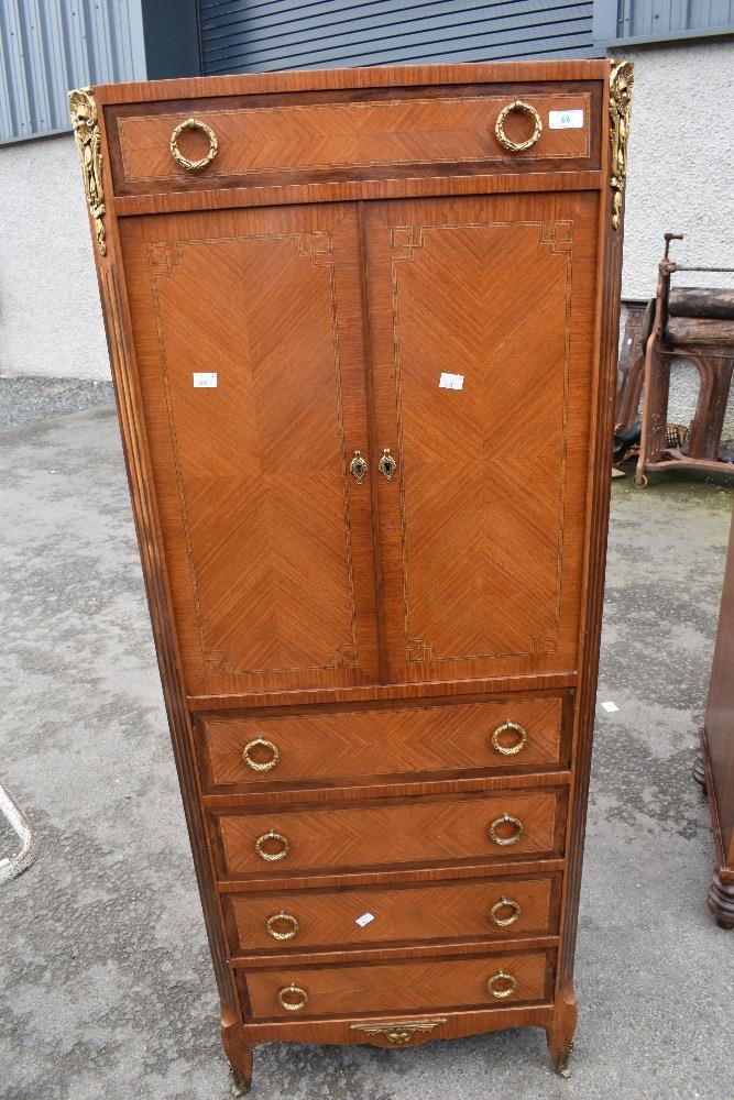 A period style narrow cupboard with drawer under