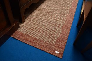 A modern polyprop rug, in Raffles Rust design, 160 x 230cm
