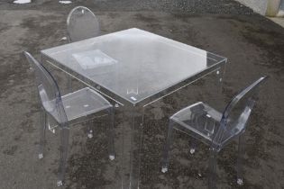A vintage clear perspex 'Ghost' style dining table and three chairs, in the manner of La Marie by
