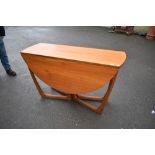 A vintage teak drop leaf table of stylised design, McIntosh style, labelled beithcraft furniture
