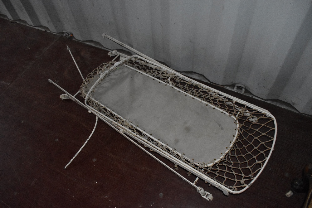 A vintage metal cot frame