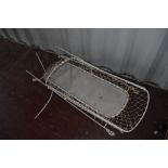 A vintage metal cot frame