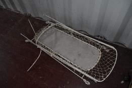 A vintage metal cot frame