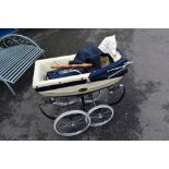 A vintage Silver Cross dolls pram