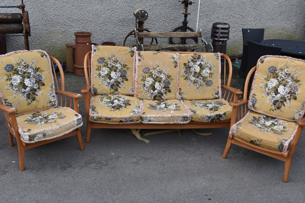 A vintage Ercol style three piece cottage suite in light stain