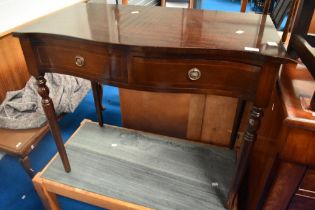 A reproduction Regency style console table of small proportions having serpentine front, width