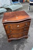 A reproduction Regency style mahogany bedside chest of drawers