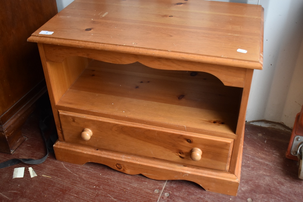 A natural pine TV cabinet, approx 68 x 41cm