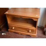 A natural pine TV cabinet, approx 68 x 41cm