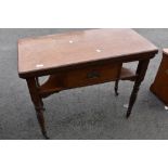 A Victorian fold over card table having frieze drawer and under shelf