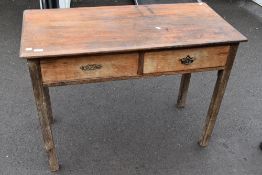 A 19th Century and later rustic kitchen side table with two frieze drawers, width approx. 107cm