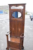 A late 19th or early 20th Century oak hall stand in the Jacobean revival style with Art Nouveau