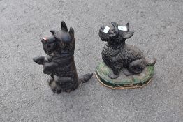 Two cast door stops modelled as scotty dogs
