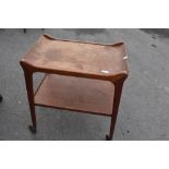 A vintage teak tea trolley having removable tray top