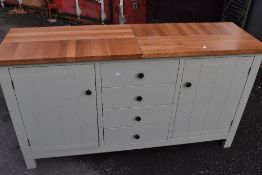 A modern sideboard having solid top, dimensions approx. W153 H86 D45