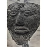 Two monochrome photographic prints of Egyptian or African masks, framed, mounted, and under glass,