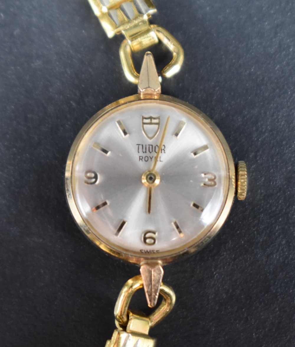 A lady's 1970's yellow metal wristwatch by Tudor having baton & Arabic numeral dial to champagne