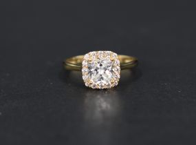 A modern cubic zirconia cluster ring, the central cushion cut cubic zirconia with a sixteen round