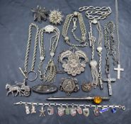 A small selection of white metal jewellery including Albertinas, bracelets and brooches,