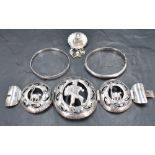 Four pieces of silver and white metal jewellery including two bangles, a Peruvian brooch in the form