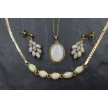 An Oval opal pendant in a 9ct gold collared mount on a 9ct gold chain, approx 18' & 2.7g with a