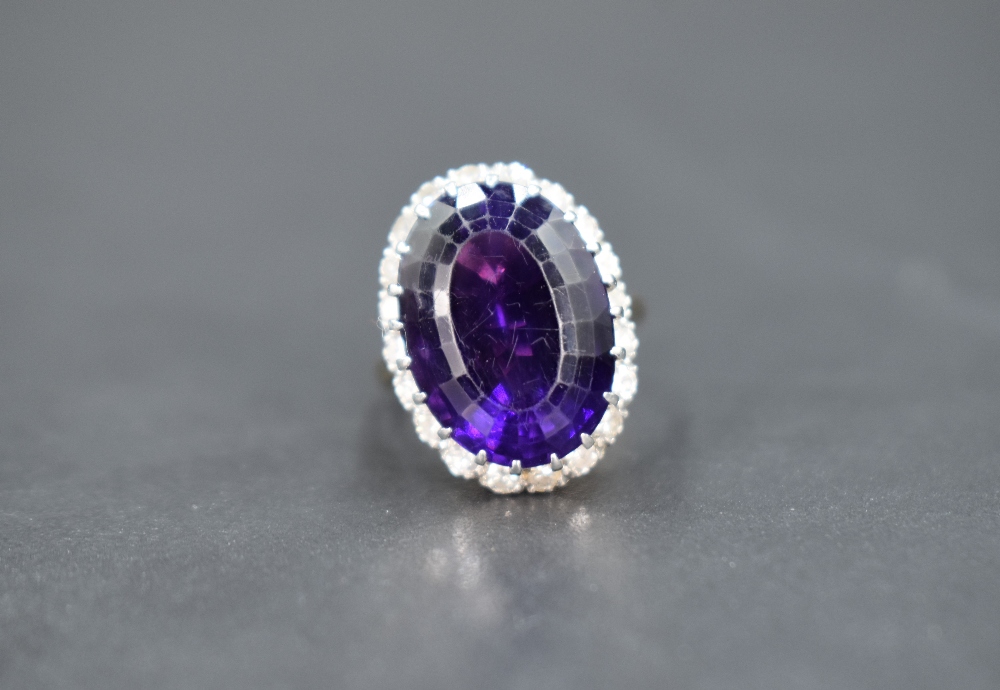 An amethyst and diamond oval cluster ring having large oval amethyst, approx 12ct surrounded by - Image 2 of 4