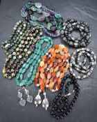A selection of beads including cloisonne style, slate, glass etc