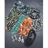 A selection of beads including cloisonne style, slate, glass etc