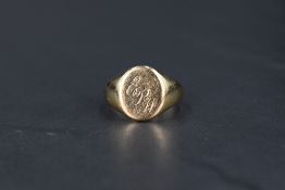 A gent's 9ct gold signet ring bearing monogrammed panel, size R & approx 6.2g
