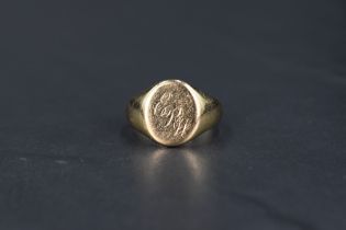 A gent's 9ct gold signet ring bearing monogrammed panel, size R & approx 6.2g